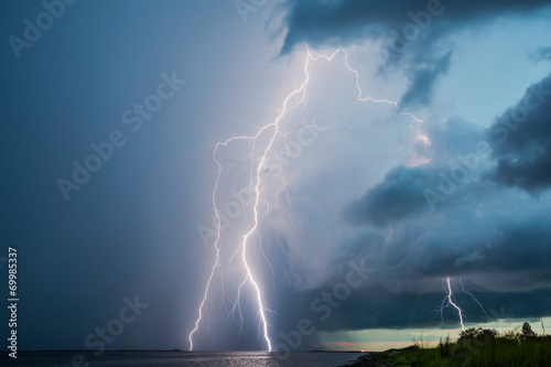 Thunderstorm lightnings in sky, lightning strikes #69985337
