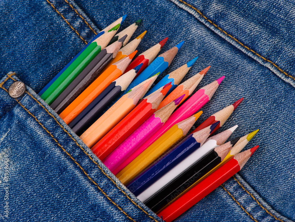 back to school set of multicolored pencils in blue jeans pocket back to school set of multicolored pencils in blue jeans pocket