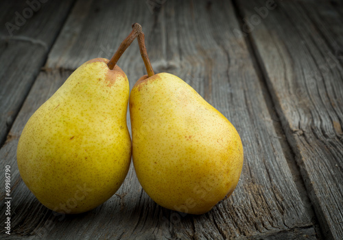 sweet pear closeup on wooden background