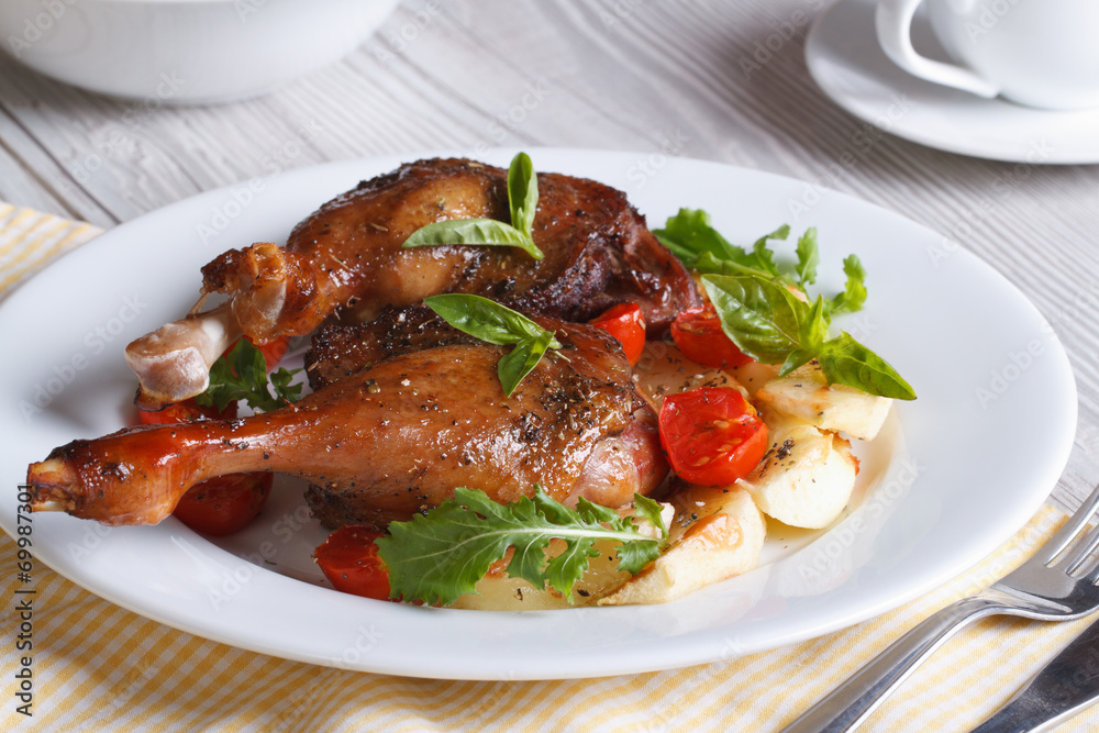 Tasty lunch: fried duck legs, with apples, tomatoes and herbs Tasty lunch: fried duck legs, with apples, tomatoes and herbs