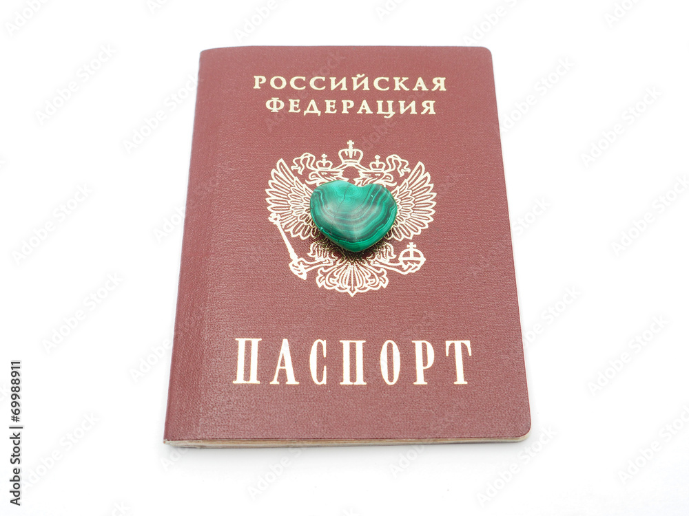 malachite heart and Russian passport on white background malachite heart and Russian passport on white background