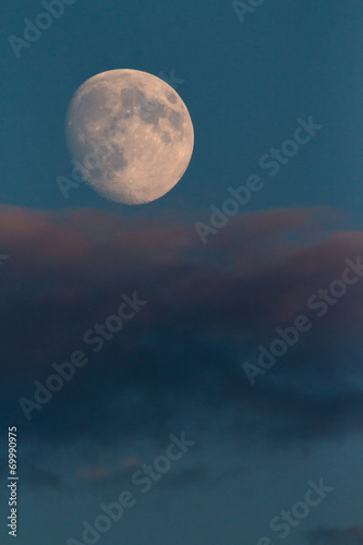  moonrise  over a cloud