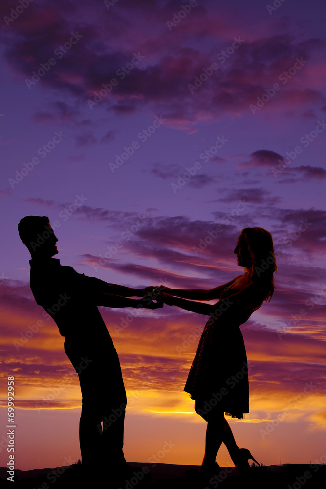silhouette couple dance lean back