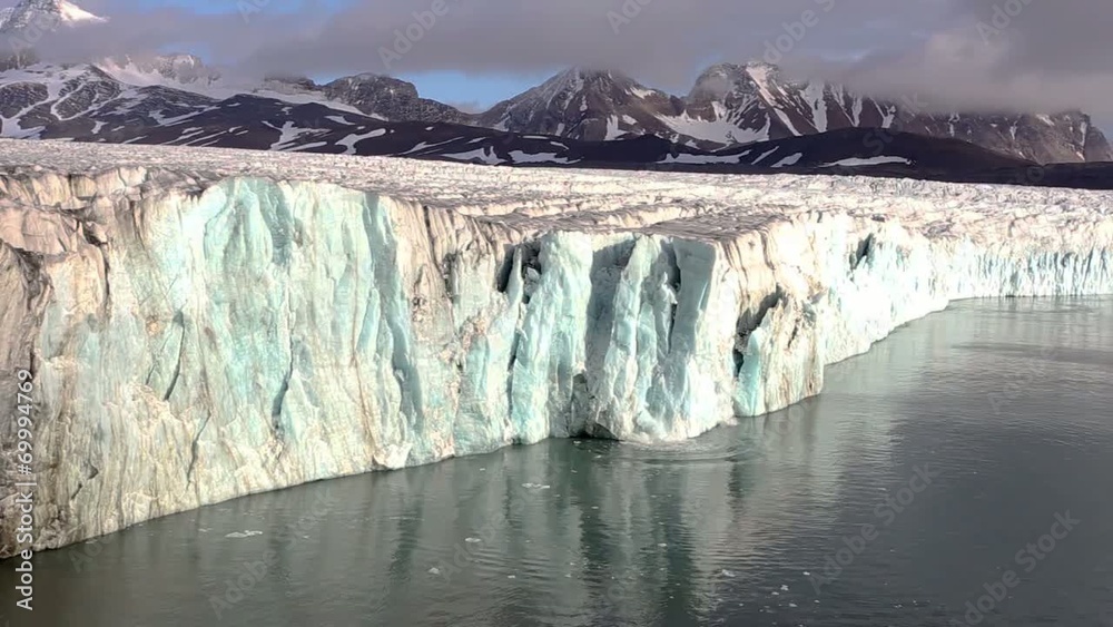 Ice Calving From The Tidewater Glacier In The Arctic