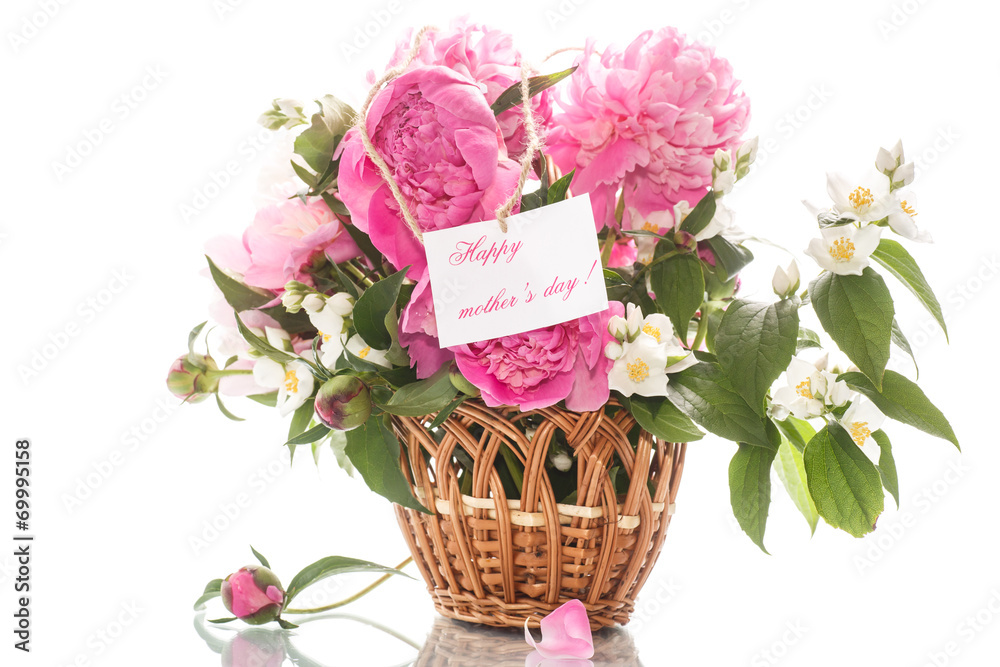 beautiful bouquet of peonies and jasmine in a basket