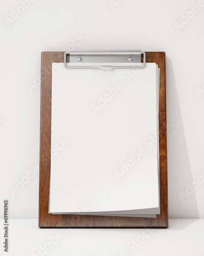 blank wooden clipboard ion the white wall and floor