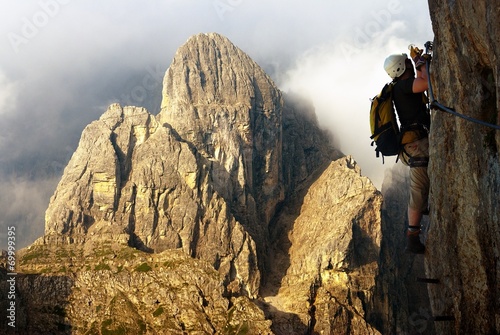 climber on via ferrata or klettersteig in Italy