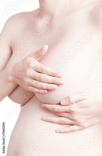 Wallpaper Mural adult woman examining her breast for lumps or breast cancer Torontodigital.ca