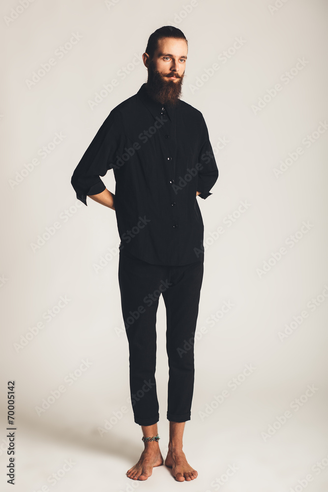 Young handsome man in black shirt on white background Young handsome man in black shirt on white background
