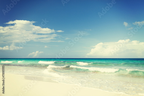 blue sea or ocean  white sand and sky with clouds