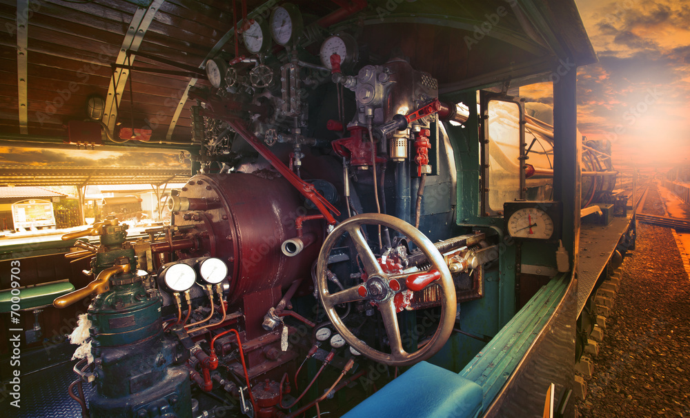 inside control room of stream engine locomotive train parking on