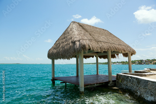 palapa on the waterer in Lake Bacalar Mexico photo