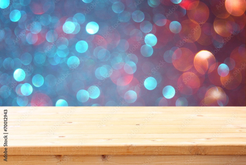 image of front rustic table and colorfull bokeh lights backgroun