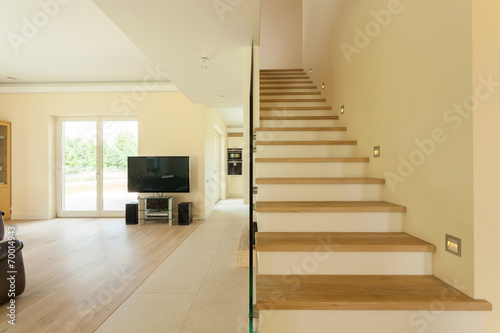 Spacious living room with staircase