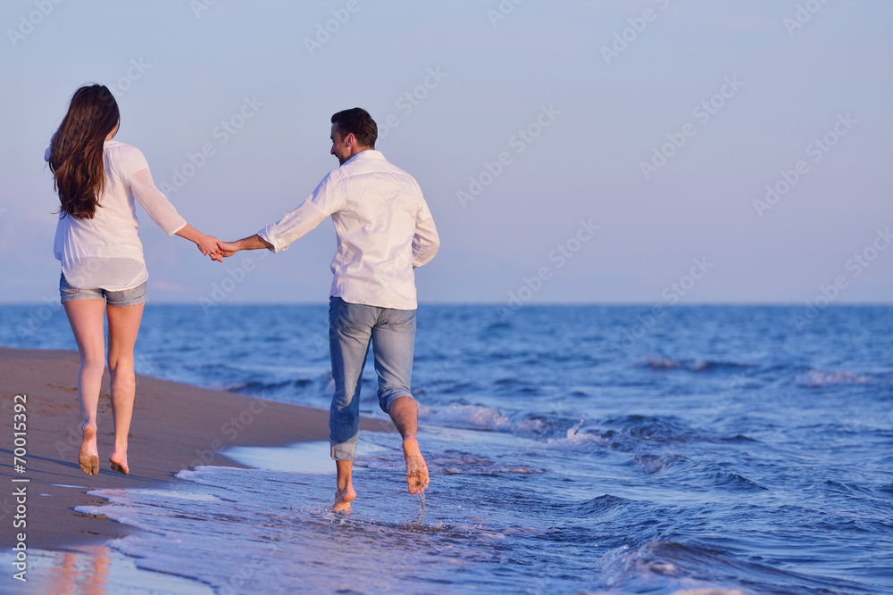 young couple on beach have fun young couple on beach have fun