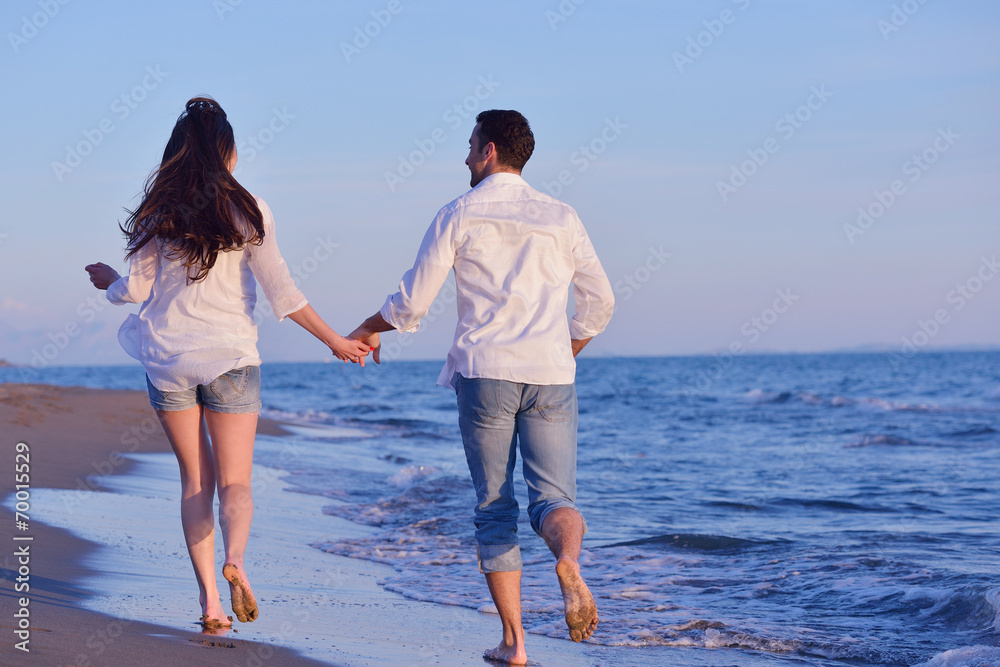 young couple  on beach have fun