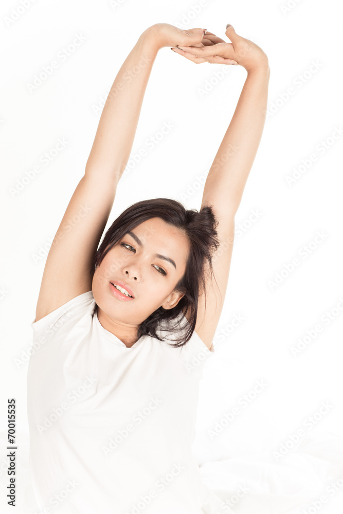 Portrait of a beautiful young woman in bed