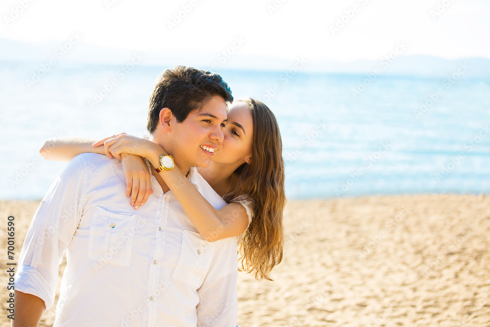 Smiling couple by the sea on a sunny summer, autumn day Smiling couple by the sea on a sunny summer, autumn day