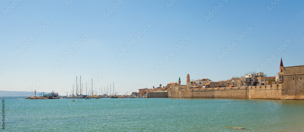 Port of Acre, Israel. with boats and the old city background.