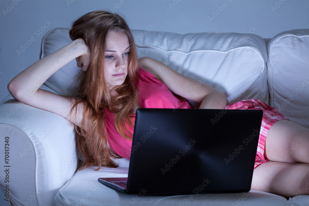 Girl in pajamas writing on forums Girl in pajamas writing on forums