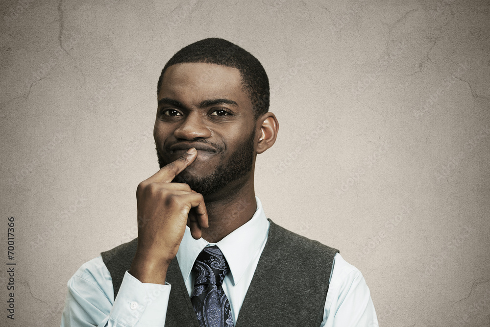 Puzzled business man thinking looking confused, puzzled Puzzled business man thinking looking confused, puzzled