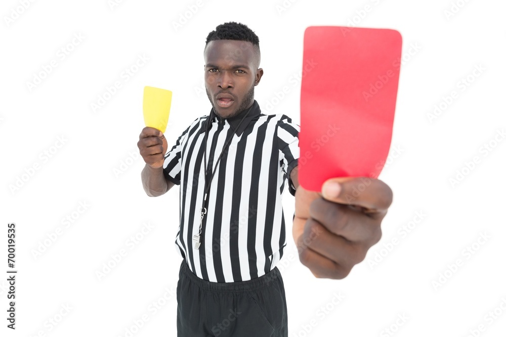 Serious referee showing yellow and red card Serious referee showing yellow and red card