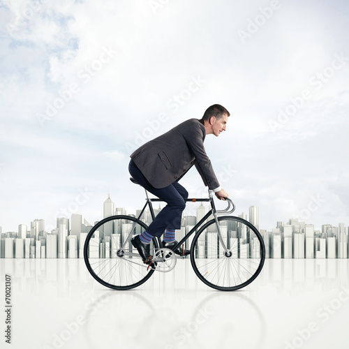 Businessman on a bicycle photo