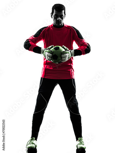 caucasian soccer player goalkeeper man holding ball silhouette