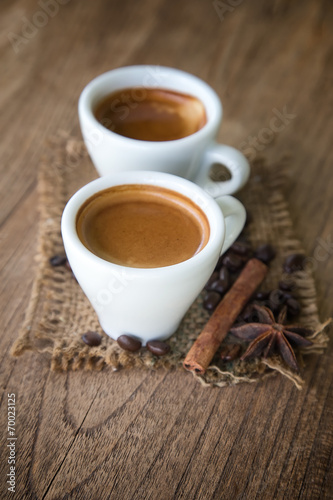a cup of espresso on grunge wooden background
