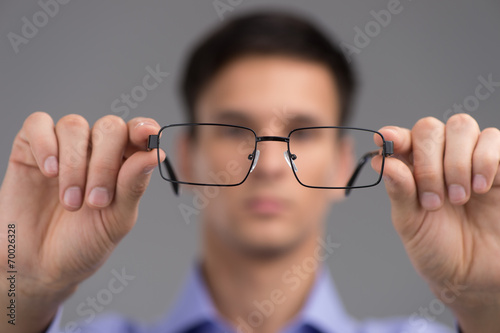 man wearing glasses to improve vision.