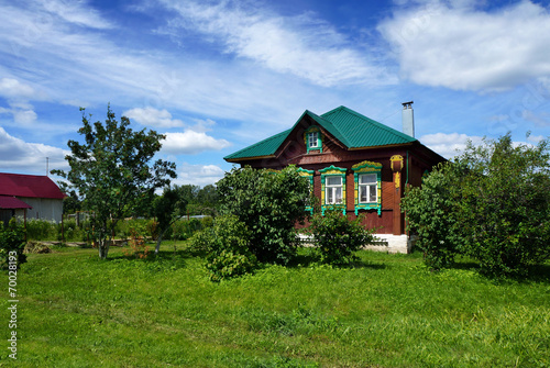 Summer landscape with old wooden house