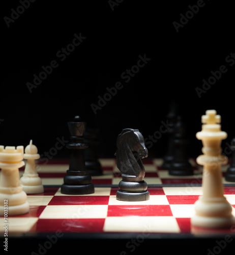 Chess character on black background for strategy business concep