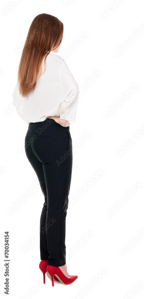 back view of redhead business woman contemplating.
