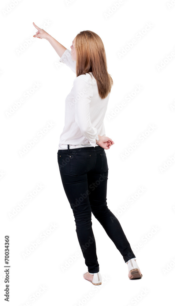 Back view of pointing woman. Back view of pointing woman.