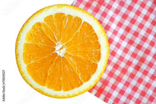 sliced orange fruit on table cloth  isolate on white background.