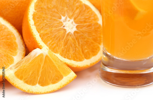 Oranges with glass of juice