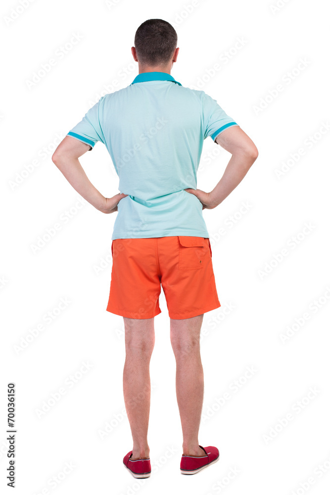 Back view of young manin shorts looking. Back view of young manin shorts looking.