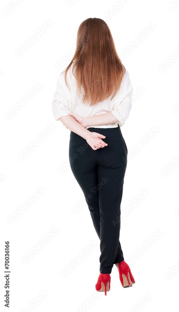 back view of redhead business woman contemplating. back view of redhead business woman contemplating.