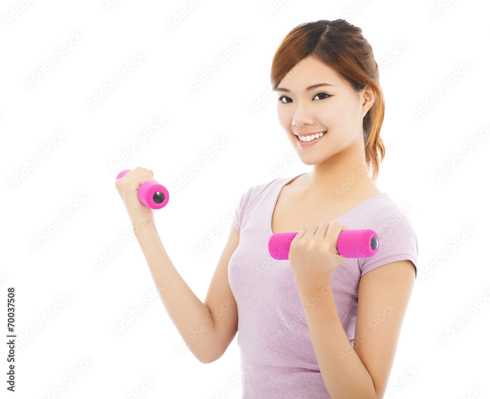 Young woman working out with dumbbells isolated on white Young woman working out with dumbbells isolated on white