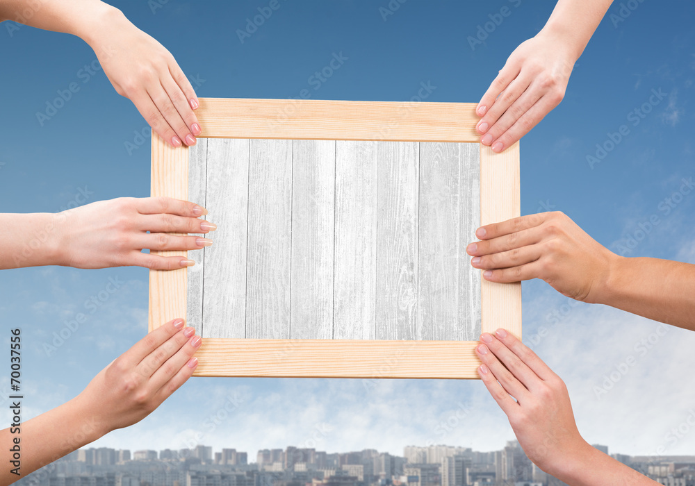 Hands holding frame Hands holding frame