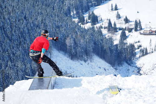 Billede på lærred Young snowboarder enjoys winter vacation and fun in the snow.