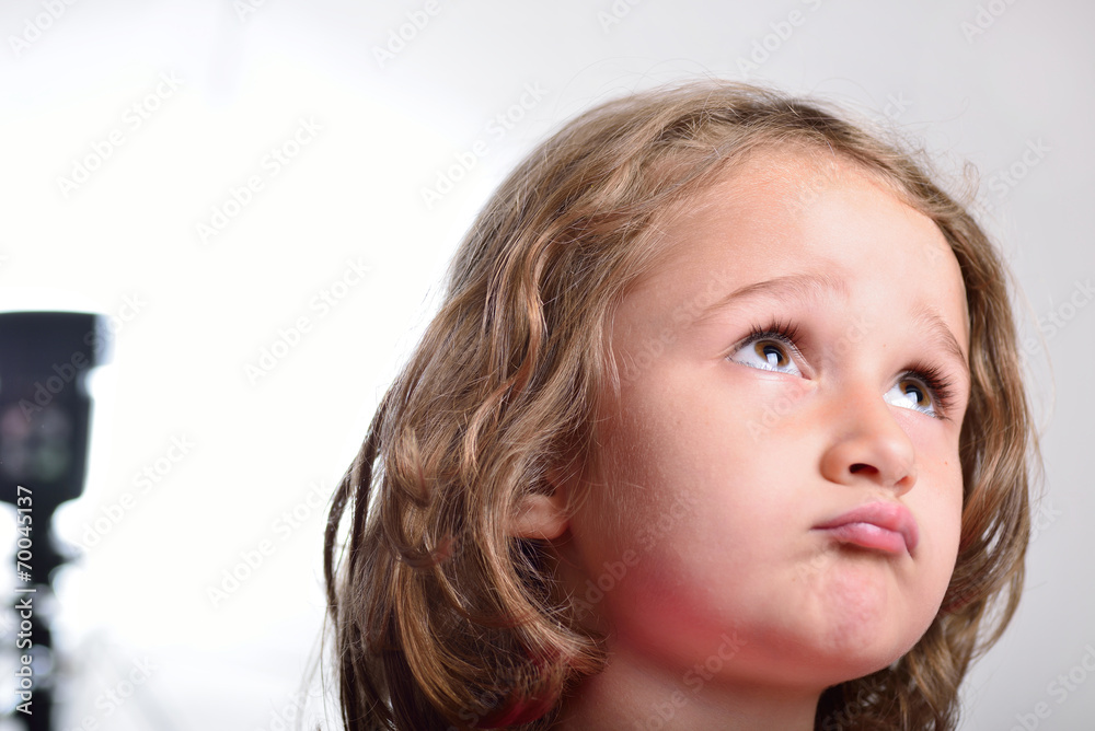 Little girl visiting and having fun in a photo studio Little girl visiting and having fun in a photo studio