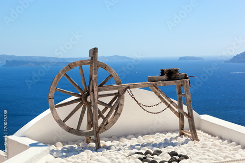 Old craftsmanship machine on the roof. Santorini island, Greece