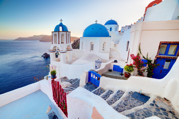Oia town on Santorini island, Greece at sunset. Aegean sea.