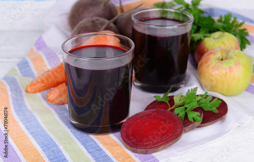 Glasses of fresh beet juice and vegetables