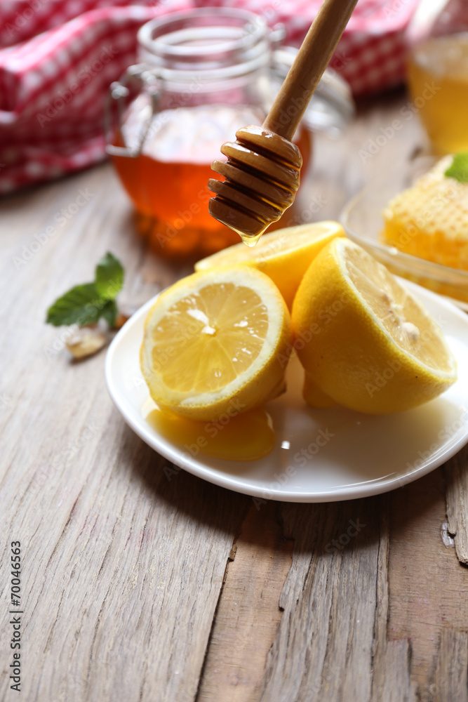 Lemon and honey on wooden table Lemon and honey on wooden table