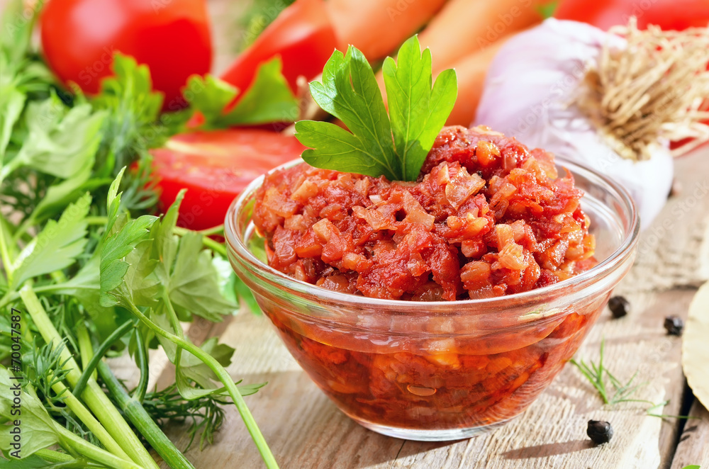 Homemade tomato sauce on rustic wooden table Homemade tomato sauce on rustic wooden table