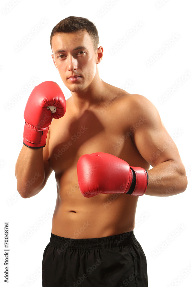 Handsome young muscular sportsman with boxing gloves isolated