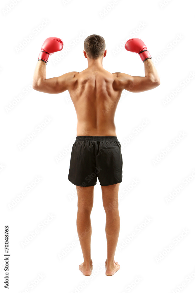 Handsome young muscular sportsman with boxing gloves isolated