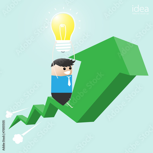 Businessman holding a light...